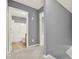 Hallway view to bathroom featuring shower with curtain at 556 Poplar Bnd, Canton, GA 30114