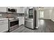 Contemporary kitchen featuring stainless steel appliances and gray accents at 556 Poplar Bnd, Canton, GA 30114