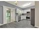 Modern kitchen with stainless steel appliances and gray backsplash at 556 Poplar Bnd, Canton, GA 30114