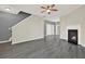 Inviting living space boasts fireplace, ceiling fan, and modern gray floors at 556 Poplar Bnd, Canton, GA 30114