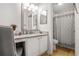 Updated bathroom featuring new vanity, lighting, and a shower-tub combination at 1303 Wingate Way, Atlanta, GA 30350
