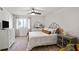 Bedroom with a queen bed, ceiling fan, and neutral decor at 1303 Wingate Way, Atlanta, GA 30350
