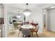 Dining room with decorative chandelier, adjacent to the living room and kitchen at 1303 Wingate Way, Atlanta, GA 30350