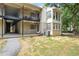 Exterior of building featuring balconies, stairs, stucco, and well maintained surroundings at 1303 Wingate Way, Atlanta, GA 30350