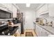 Well-lit kitchen features stainless steel appliances and white subway tile backsplash at 1303 Wingate Way, Atlanta, GA 30350
