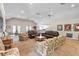 Spacious living room with beamed ceilings, ceiling fans, and comfortable seating arrangements at 1303 Wingate Way, Atlanta, GA 30350