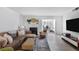 Living room featuring wood-style floors, comfortable seating, and a fireplace at 1303 Wingate Way, Atlanta, GA 30350