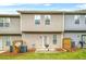 A townhouse backyard with a patio, grill, and privacy fence at 1622 Honeysuckle Path, Conyers, GA 30012