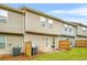 A townhouse backyard with a patio, grill, and privacy fence at 1622 Honeysuckle Path, Conyers, GA 30012