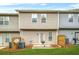 A townhouse backyard with a patio, grill, and privacy fence at 1622 Honeysuckle Path, Conyers, GA 30012
