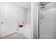 Bright bathroom with a separate tub, shower, and tile flooring at 1622 Honeysuckle Path, Conyers, GA 30012