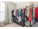 Walk in closet features wire shelving; neutral carpet and walls at 1622 Honeysuckle Path, Conyers, GA 30012