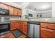 Traditional kitchen with stainless steel appliances and granite countertops at 1622 Honeysuckle Path, Conyers, GA 30012