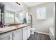 Bright bathroom features a double sink vanity with a toilet and tub/shower combo at 251 Hunt Club Cir, Temple, GA 30179