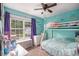 Colorful bedroom featuring a bunk bed, ceiling fan and lots of natural light at 251 Hunt Club Cir, Temple, GA 30179