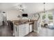 Cozy kitchen and living room combo featuring stainless steel appliances and a large fireplace at 251 Hunt Club Cir, Temple, GA 30179