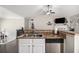 Bright kitchen features stainless steel appliances, brown countertops and wood-look floors at 251 Hunt Club Cir, Temple, GA 30179