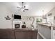 Open-concept living space with fireplace, vaulted ceiling and seamless flow into the kitchen at 251 Hunt Club Cir, Temple, GA 30179