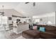 Living room with kitchen area featuring vaulted ceiling and stylish breakfast bar seating at 251 Hunt Club Cir, Temple, GA 30179