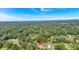 Aerial view of property, featuring a home surrounded by lush greenery and mature trees at 2664 Olive Springs Se Rd, Marietta, GA 30060