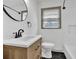 Modern bathroom featuring a sleek vanity, new fixtures, and decorative tiling that enhances its clean and updated design at 2664 Olive Springs Se Rd, Marietta, GA 30060