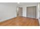 This bedroom features hardwood floors, a ceiling fan, and a closet with paneled doors at 2664 Olive Springs Se Rd, Marietta, GA 30060