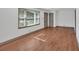 Spacious bedroom with hardwood floors, large windows, and modern ceiling fan, creating a comfortable and inviting atmosphere at 2664 Olive Springs Se Rd, Marietta, GA 30060