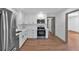 Bright and modern kitchen with stainless steel appliances, sleek countertops, and seamless flow into the living area at 2664 Olive Springs Se Rd, Marietta, GA 30060