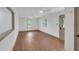 Inviting living room featuring hardwood floors, a ceiling fan, and ample natural light, creating a warm and comfortable space at 2664 Olive Springs Se Rd, Marietta, GA 30060