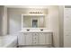 Bathroom with a double sink vanity and a large mirror at 321 Woodbrook Crst, Canton, GA 30114