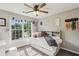 Bedroom with a ceiling fan, neutral walls, carpet floors and bright windows at 321 Woodbrook Crst, Canton, GA 30114