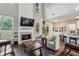 Open-concept living room with a fireplace and views of the kitchen at 321 Woodbrook Crst, Canton, GA 30114