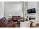 Inviting living room features high ceilings, a fireplace, and modern decor at 321 Woodbrook Crst, Canton, GA 30114