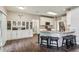 Open-concept living space with custom built in cabinets and a modern kitchen at 321 Woodbrook Crst, Canton, GA 30114