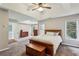 Generous main bedroom with tray ceiling, windows, neutral carpet and furniture at 321 Woodbrook Crst, Canton, GA 30114