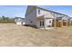 Backyard with covered patio, offering a relaxing outdoor space at 867 Pensive Run, Dacula, GA 30019