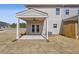 Covered patio with fan and access to the backyard providing an outdoor living space at 867 Pensive Run, Dacula, GA 30019