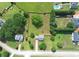 Aerial view of the home with a large, fenced backyard and neighborhood at 1012 Gloria Grand Blvd, Mcdonough, GA 30252