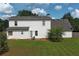 View of the back of the house and the large backyard at 1012 Gloria Grand Blvd, Mcdonough, GA 30252