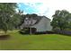 View of the well-maintained lawn and the side of the two-story house at 1012 Gloria Grand Blvd, Mcdonough, GA 30252
