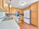 Bright kitchen featuring light wood cabinetry and stainless steel appliances at 1012 Gloria Grand Blvd, Mcdonough, GA 30252