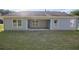 A backyard features a house with an open patio and a well-maintained lawn at 3350 Cooper Woods Dr, Loganville, GA 30052