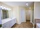 A spacious bathroom features dual sinks, and a separate tub and shower at 3350 Cooper Woods Dr, Loganville, GA 30052