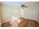 An empty bedroom features vinyl floors, a ceiling fan, and closet at 3350 Cooper Woods Dr, Loganville, GA 30052