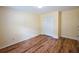 An empty bedroom with vinyl floors and a closet offers a clean, bright space at 3350 Cooper Woods Dr, Loganville, GA 30052
