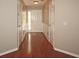 Bright and welcoming entryway featuring hardwood floors and classic paneled walls at 3350 Cooper Woods Dr, Loganville, GA 30052
