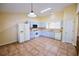 Open kitchen area with tile floors, cabinetry, and plenty of natural light at 3350 Cooper Woods Dr, Loganville, GA 30052