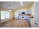 Bright eat-in kitchen featuring tile flooring, ample cabinetry, and modern appliances at 3350 Cooper Woods Dr, Loganville, GA 30052