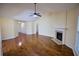 Expansive living room offering hardwood floors, fireplace, and views into the dining area at 3350 Cooper Woods Dr, Loganville, GA 30052