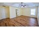 Bright main bedroom featuring tray ceilings, wood flooring, and an ensuite bathroom at 3350 Cooper Woods Dr, Loganville, GA 30052